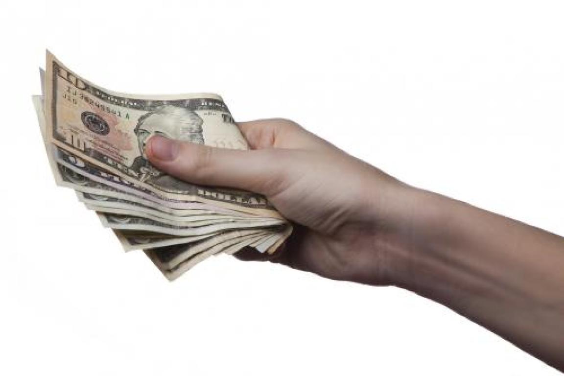 Hands holding cash